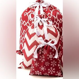 Four reusable cloth gift bags. New!